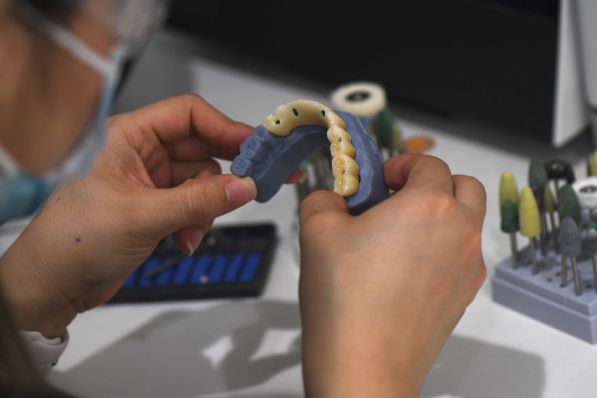 Woo Dental clinician planning a custom restoration