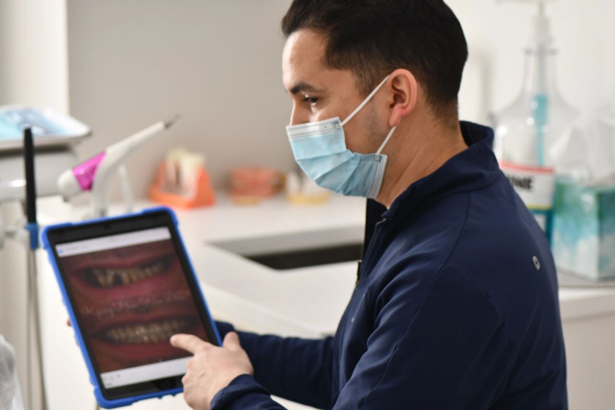 Woo Dental clinician reviewing digital smile imaging